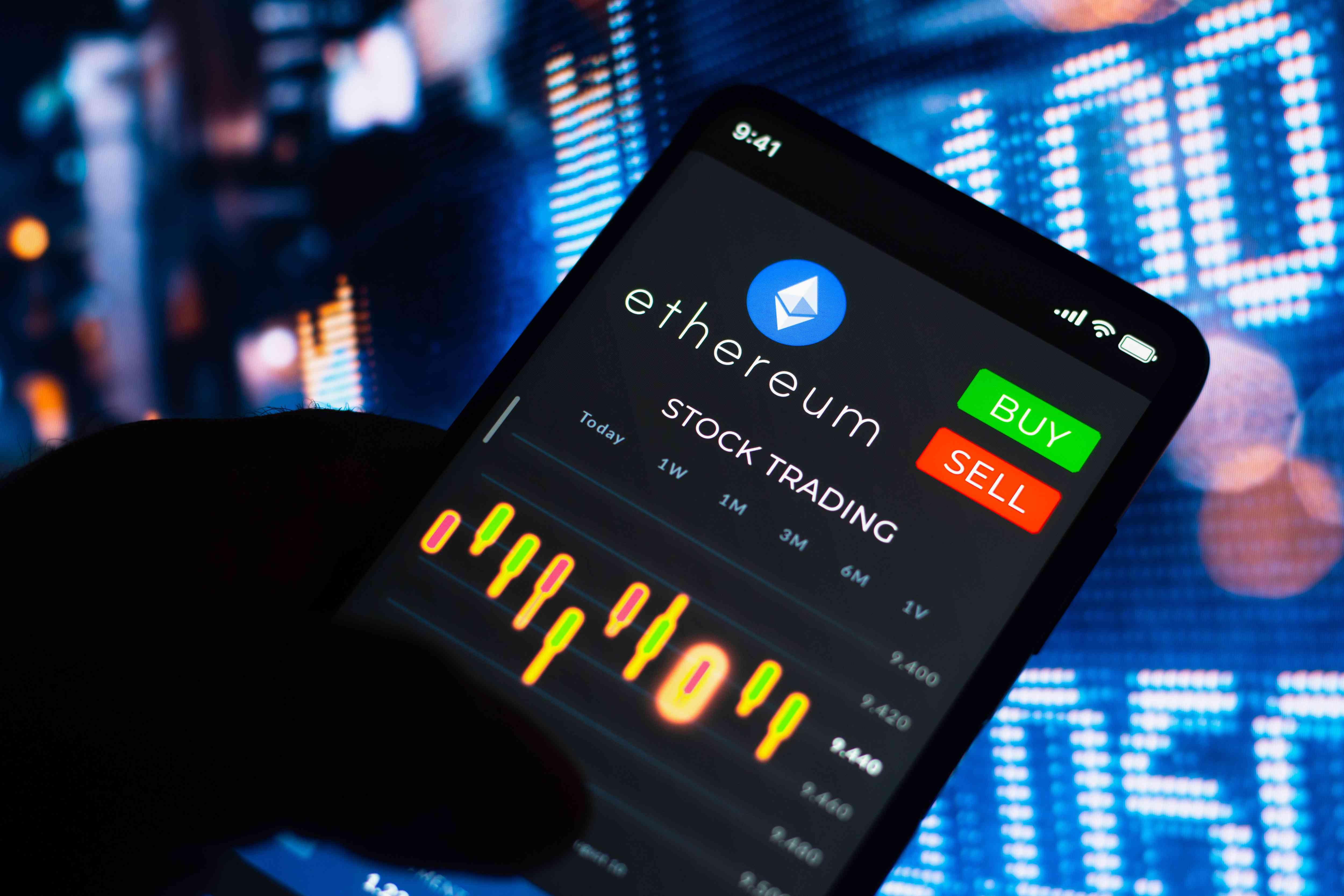 A close-up of a mobile device showing a trading screen with Ethereum